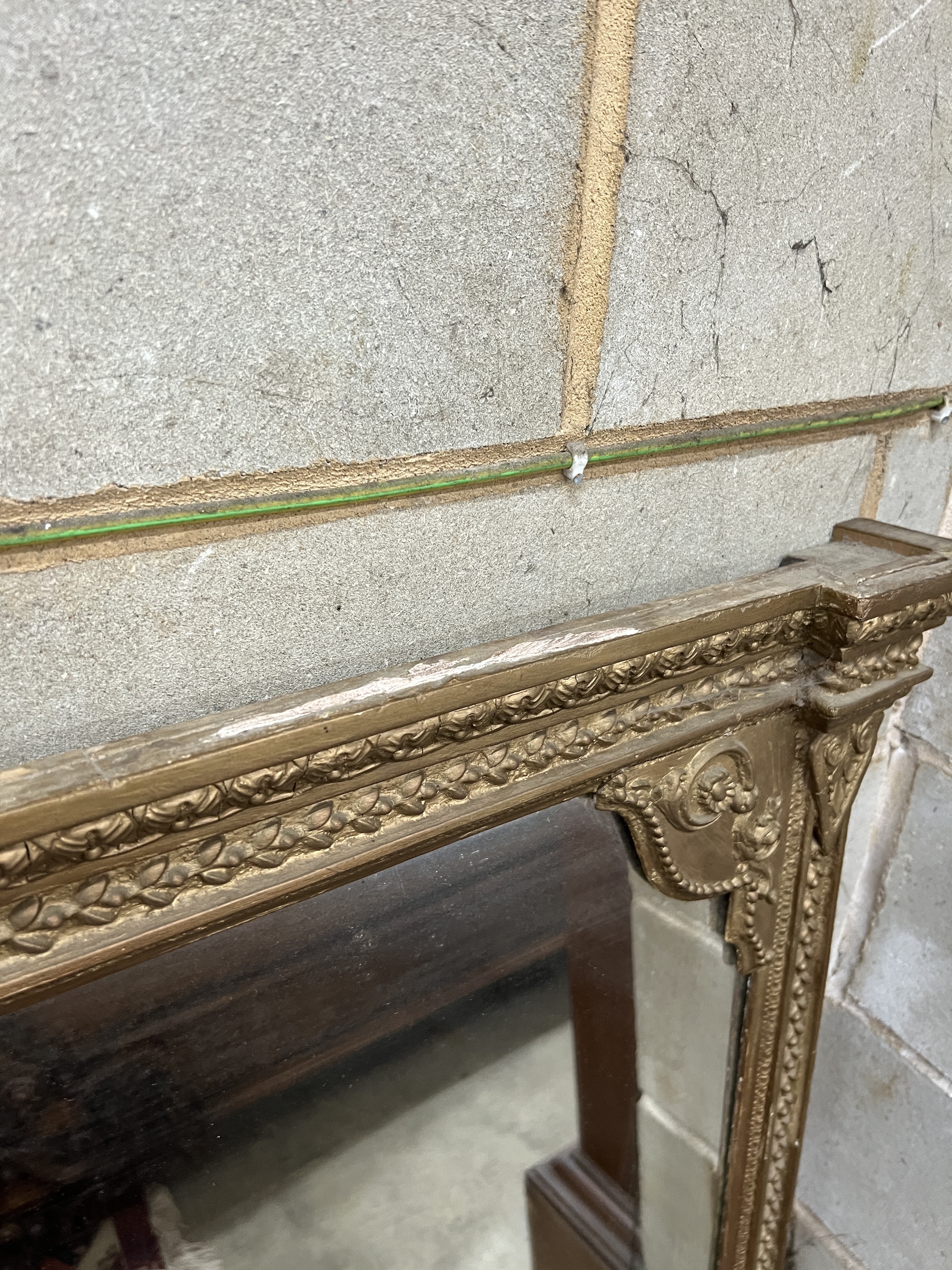 A Victorian giltwood and composition overmantel mirror, repainted, width 124cm, height 134cm